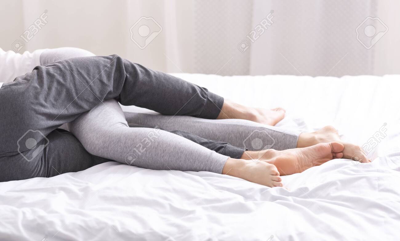 Romantic Mood Couple In Love Embracing On Bed In Casual Clothes