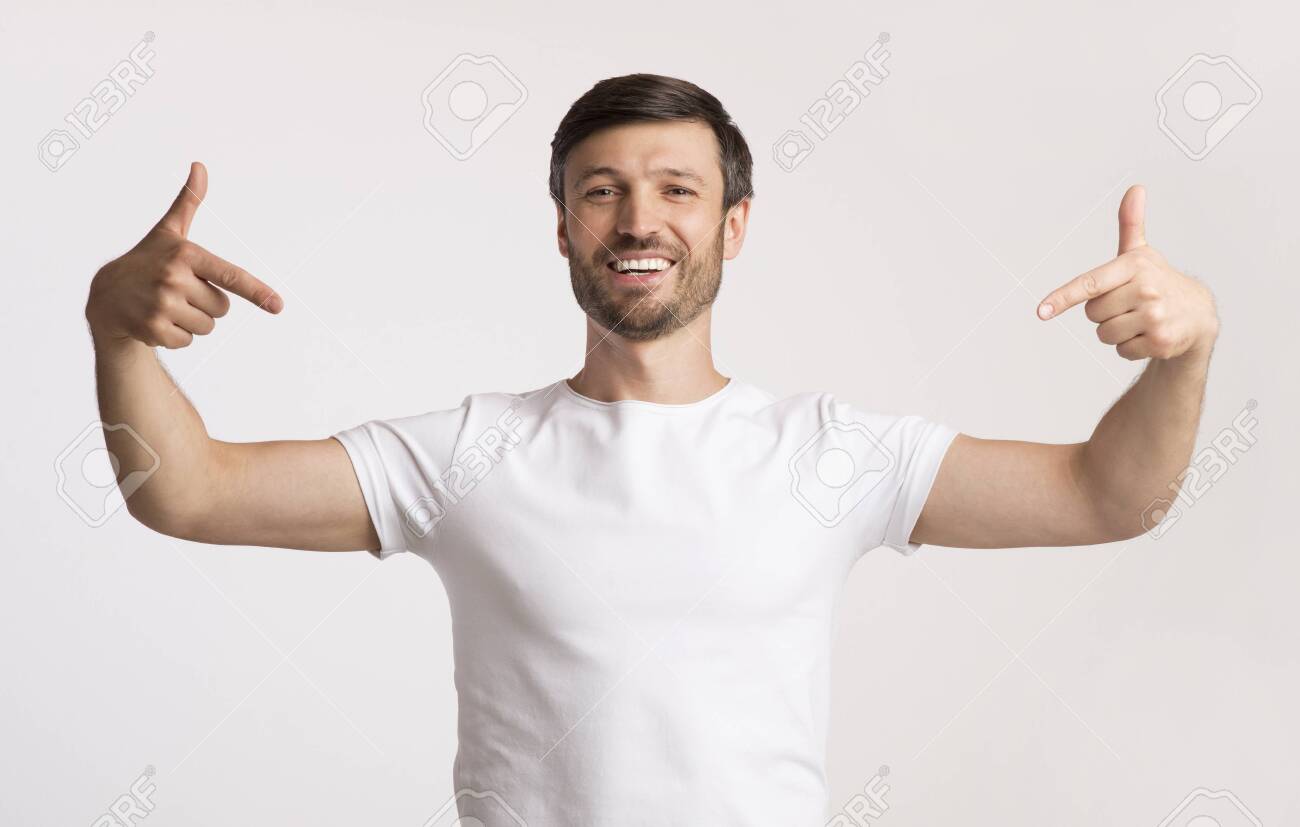 Look At Me. Positive Man Pointing Fingers At Himself Standing On White  Background. Studio Shot Stock Photo, Picture and Royalty Free Image. Image  135297842.