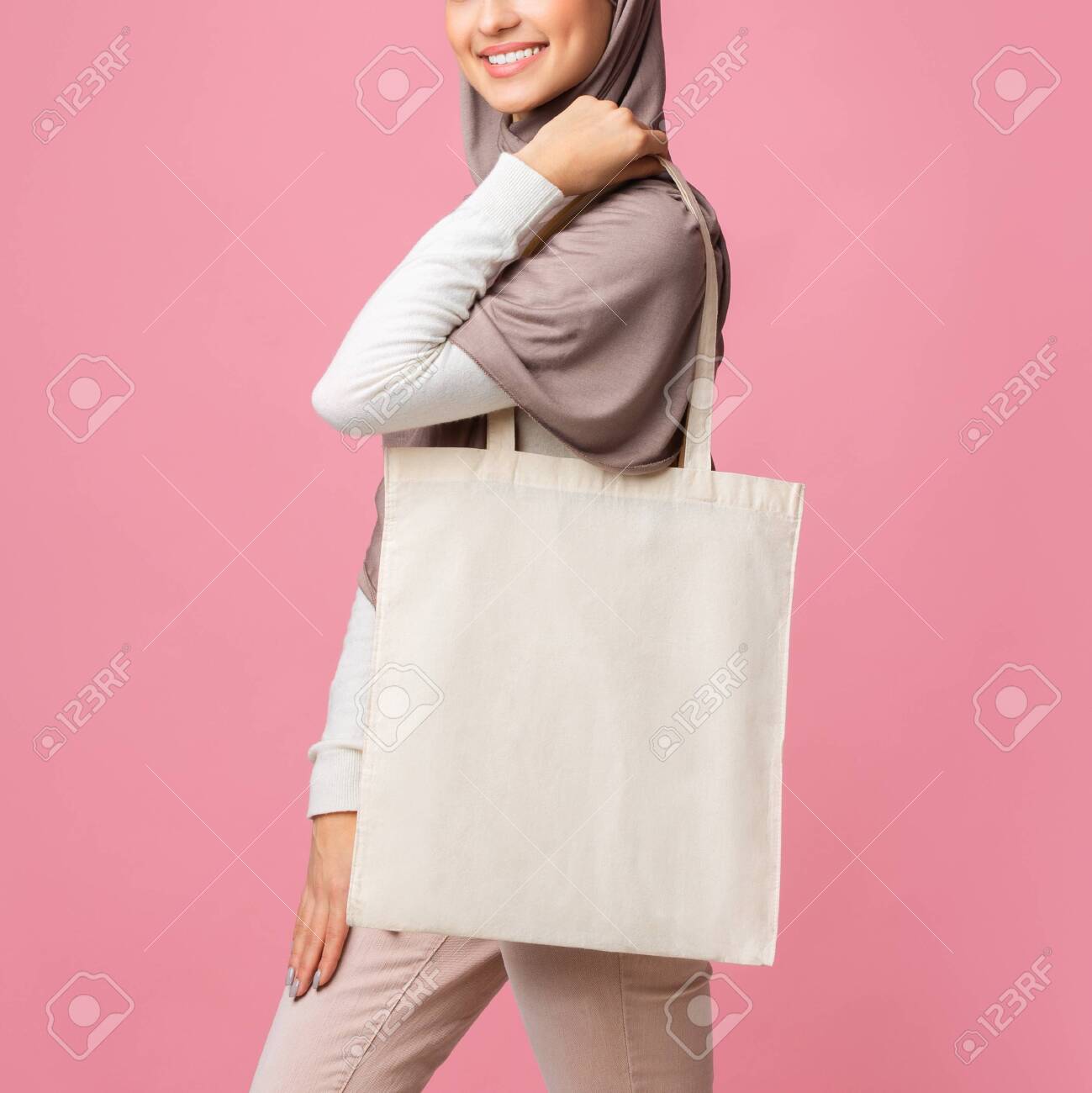 Download Mockup Image Of Muslim Girl Holding Blank Canvas Tote Bag Wearing Stock Photo Picture And Royalty Free Image Image 138229355