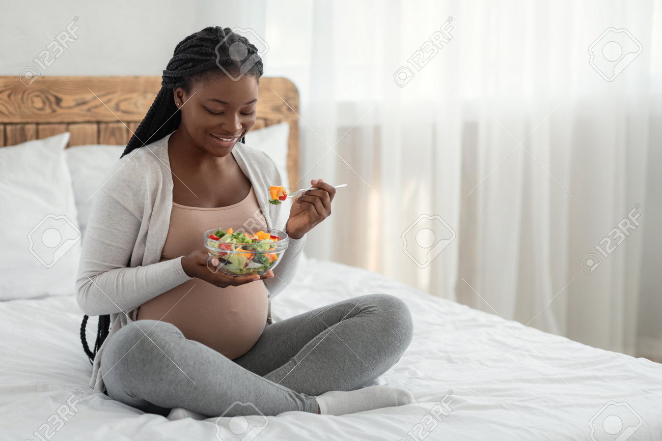 Pregnant Woman Nutrition Happy Black Expecting Lady Eacting Stock Photo Picture And Royalty Free Image Image 161042501