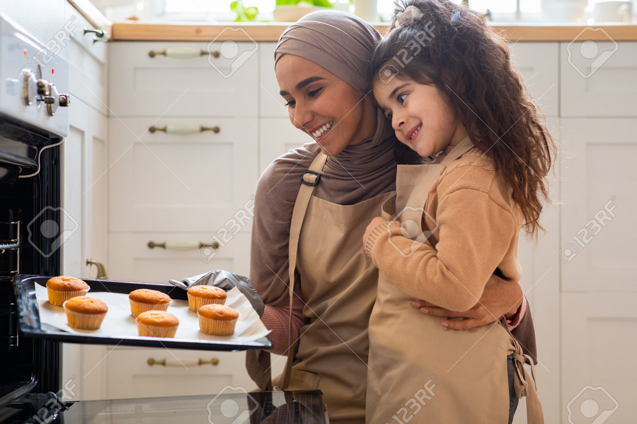 Happy Muslim Mother And Her Little