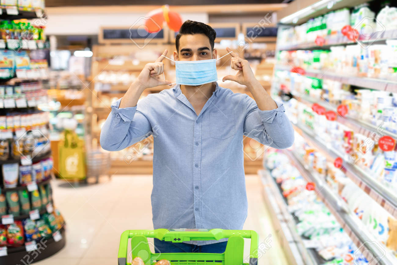 Arabic Man Wearing Protective Face Mask Buying Food In Supermarket - 167568594 Arabic Man Wearing Protective Face Mask Buying Food In Supermarket - 167568594