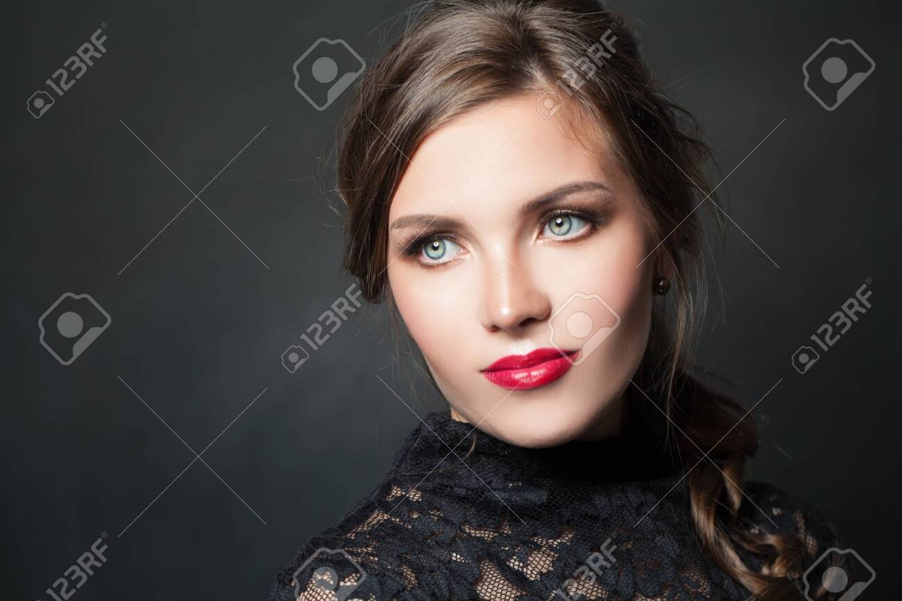 Stylish woman with red lips makeup hair on dark background - 122127444 Stylish woman with red lips makeup hair on dark background - 122127444