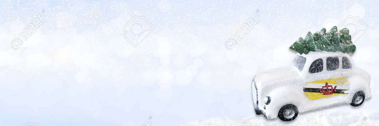 A Miniature White Christmas Car With A Flag Of Brunei Concept Of