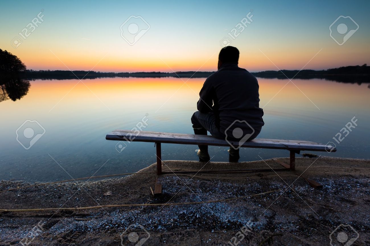 Bench on lake shore at sunset. Beautiful landscape with one man sitting and looking on sunset. Photographed in Poland. - 37944746 Bench on lake shore at sunset. Beautiful landscape with one man sitting and looking on sunset. Photographed in Poland. - 37944746