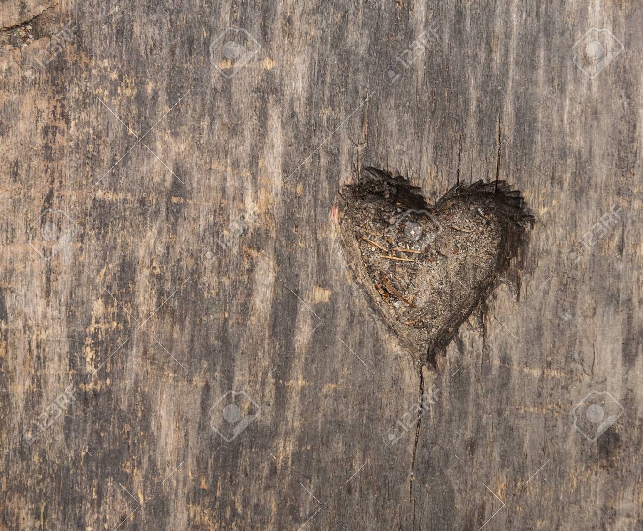 Small heart shape cut in old wood. Picture useful as background - 37946083 Small heart shape cut in old wood. Picture useful as background - 37946083