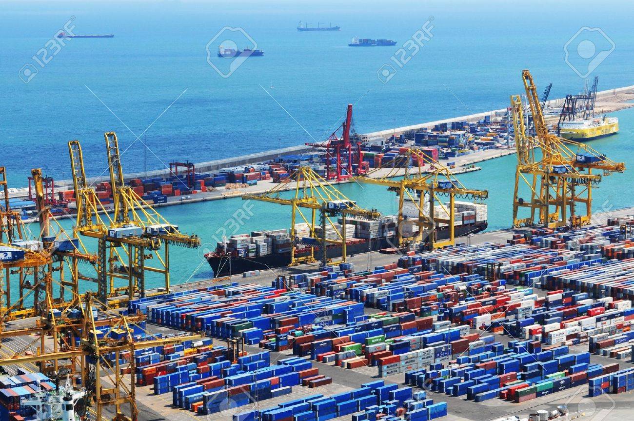 Barcelona, Spain - 05 July, 2012: Aerial view of harbour with cargo containers waiting to be loaded - 14881650 Barcelona, Spain - 05 July, 2012: Aerial view of harbour with cargo containers waiting to be loaded - 14881650