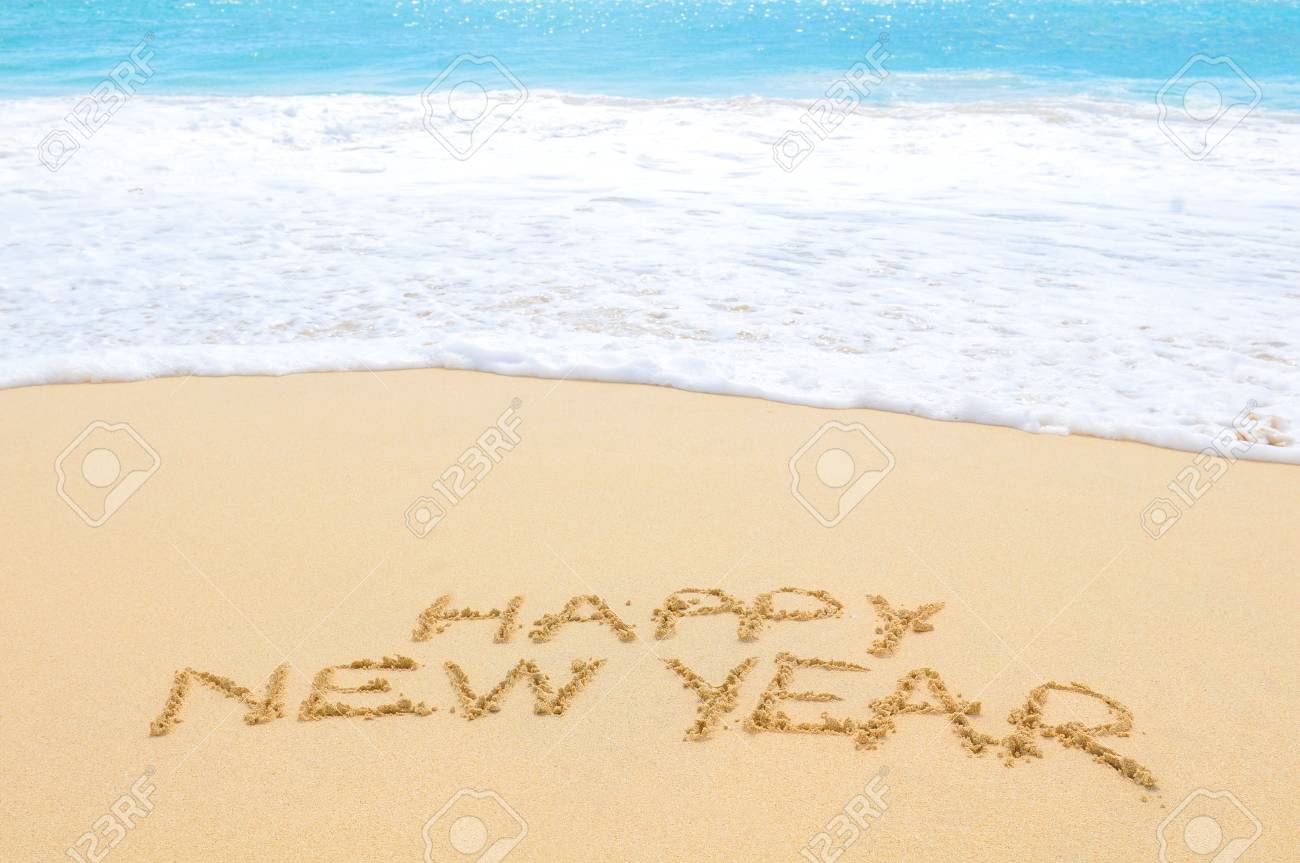 Happy New Year written on sand of an exotic beach - 96390335 Happy New Year written on sand of an exotic beach - 96390335