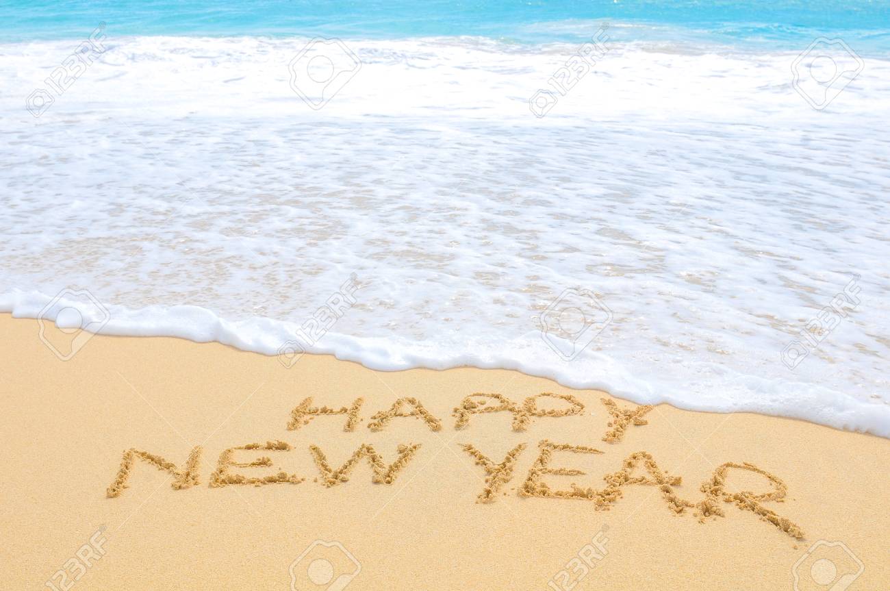 Happy New Year written on sand of an exotic beach - 96362063 Happy New Year written on sand of an exotic beach - 96362063
