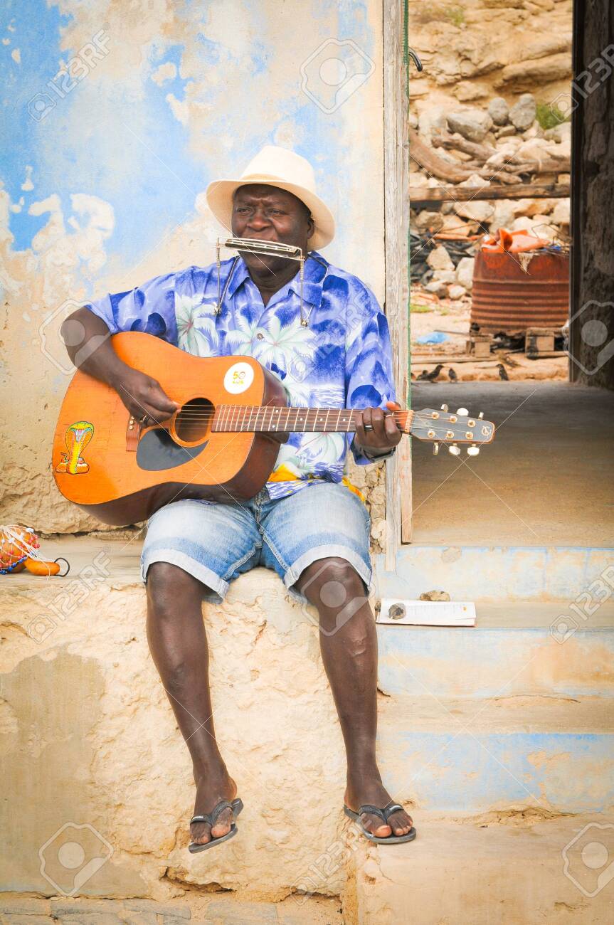 Boa Vista, Cape Verde - December 20, 2017: View of local people performing traditional music on the streets of Rabil on the island of Boa Vista, Cape Verde, Africa - 118177575 Boa Vista, Cape Verde - December 20, 2017: View of local people performing traditional music on the streets of Rabil on the island of Boa Vista, Cape Verde, Africa - 118177575