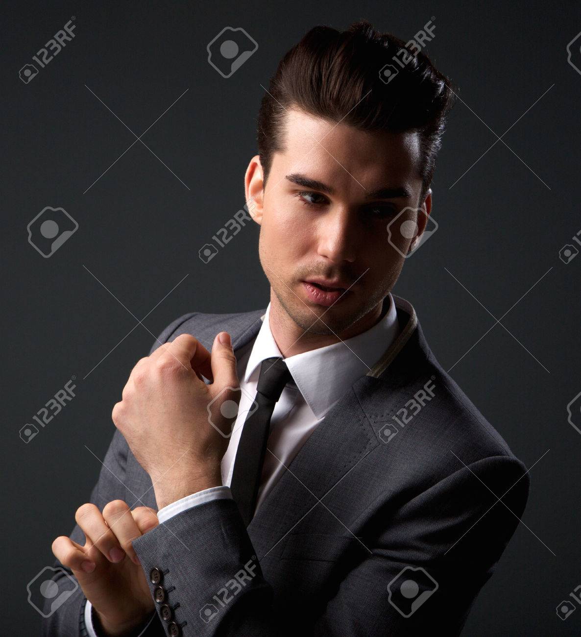 Fashionable Male Model Posing In Grey Suit Stock Photo, Picture and Royalty  Free Image. Image 26416474.