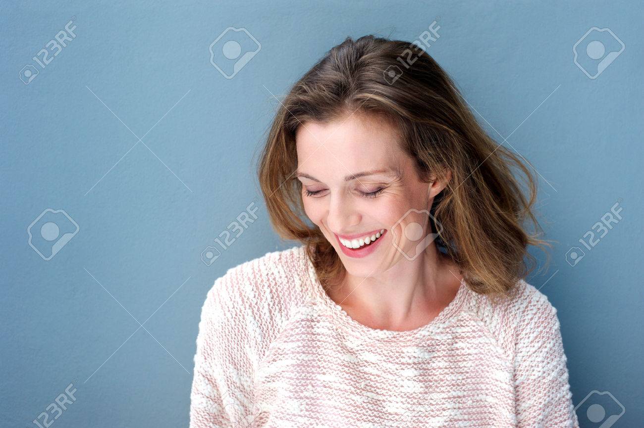 Close up portrait of a beautiful mid adult woman laughing with sweater - 37864511 Close up portrait of a beautiful mid adult woman laughing with sweater - 37864511