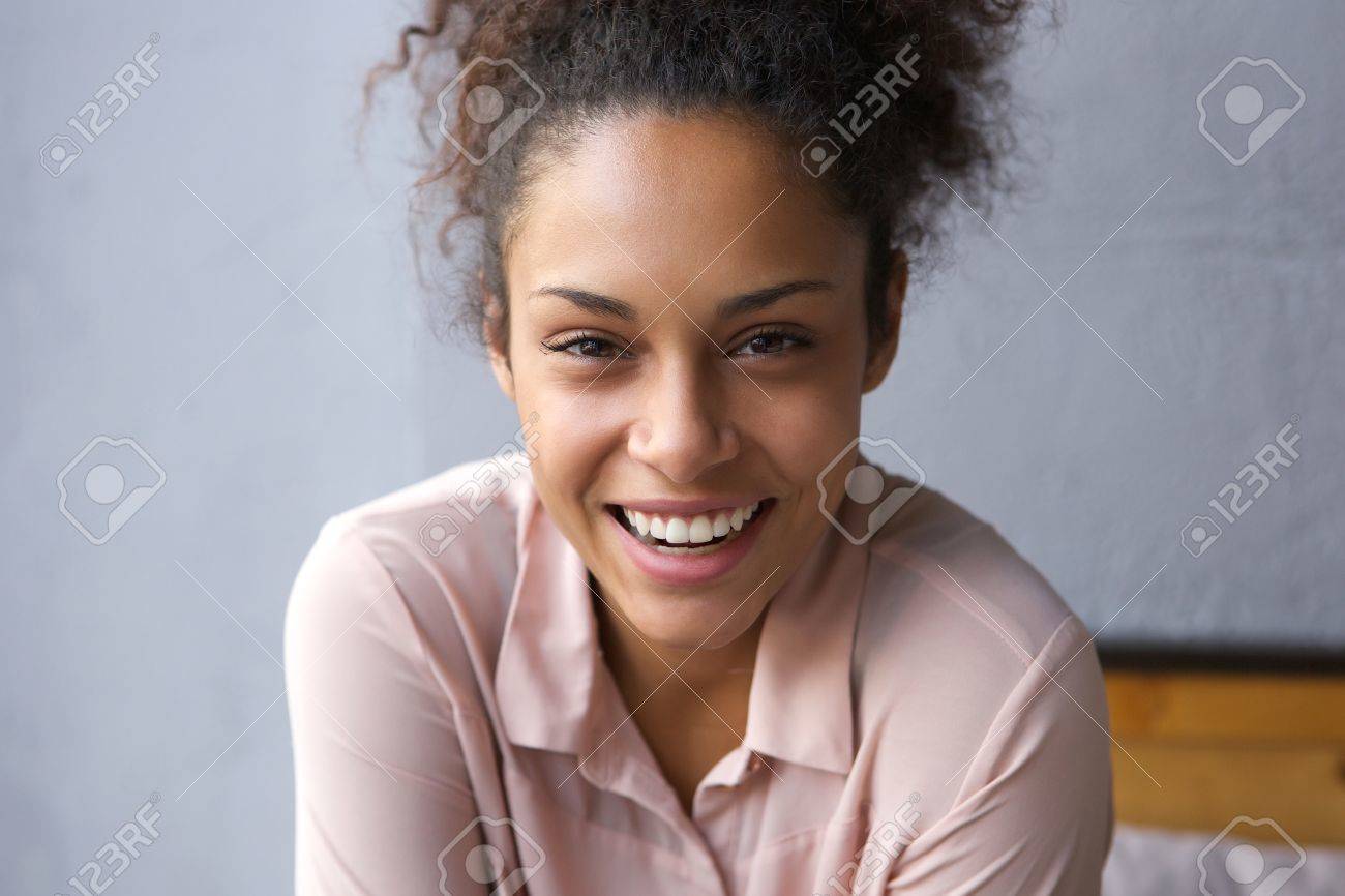Close up portrait of a happy young african american woman laughing - 40345132 Close up portrait of a happy young african american woman laughing - 40345132