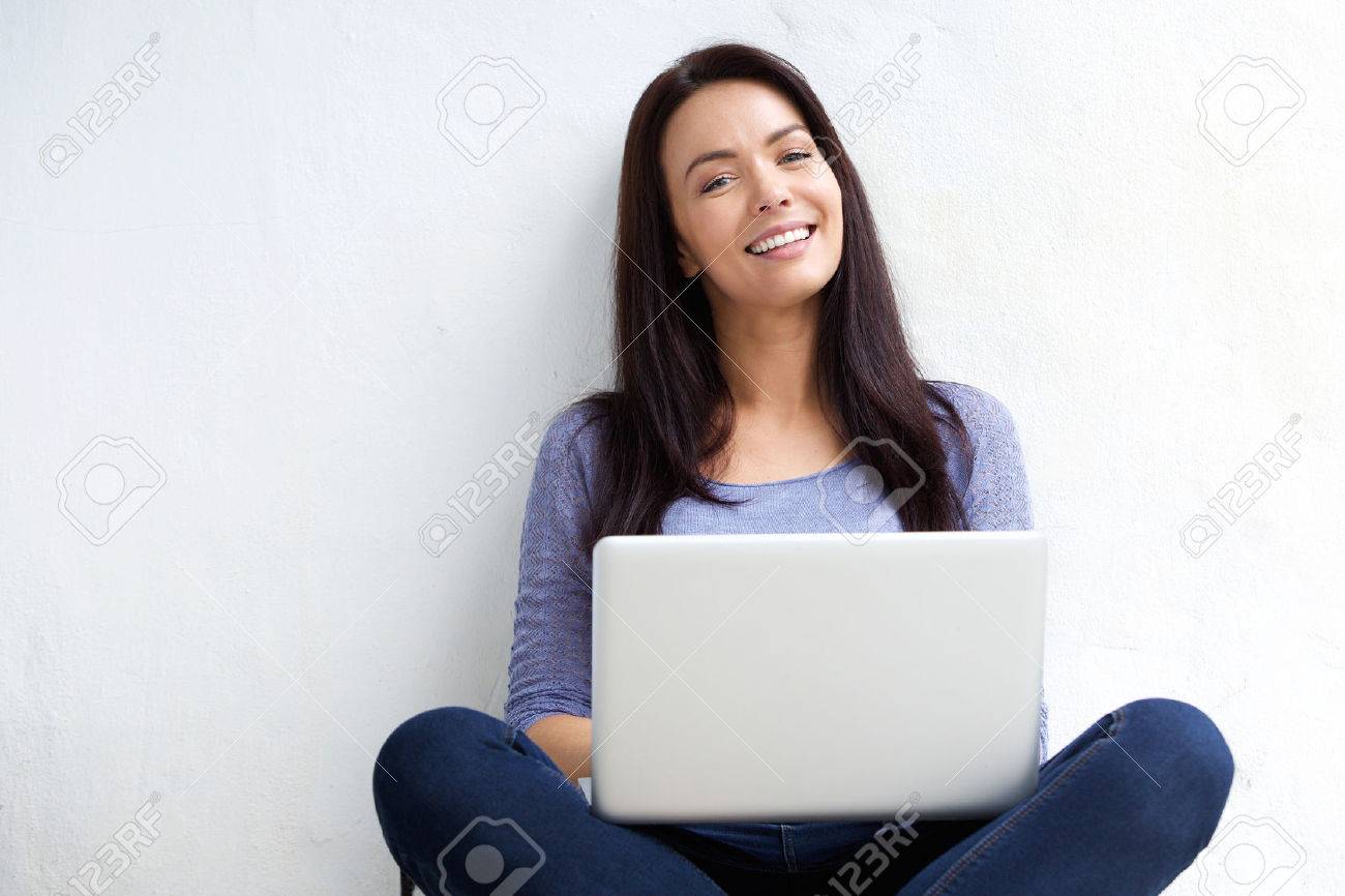 Portrait of a relaxed female student using laptop - 50593510 Portrait of a relaxed female student using laptop - 50593510