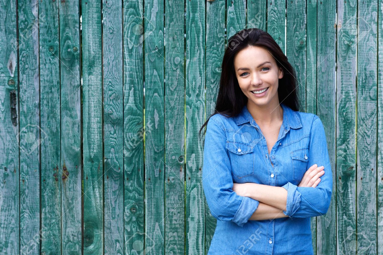 Portrait Of A Confident Woman Smiling With Arms Crossed Stock ...