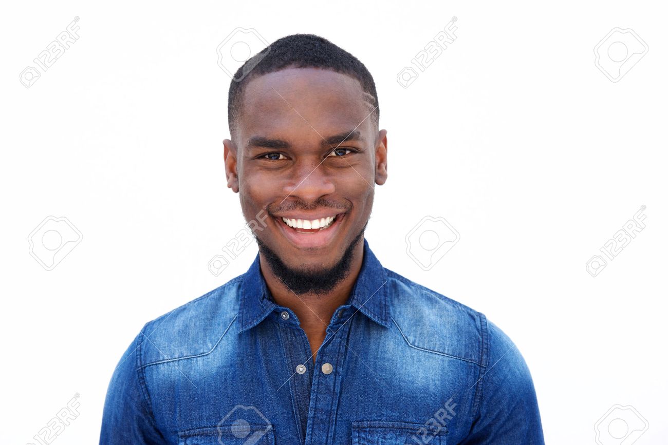 Close up portrait of a smiling young african american man in a denim shirt against white background - 53356511 Close up portrait of a smiling young african american man in a denim shirt against white background - 53356511