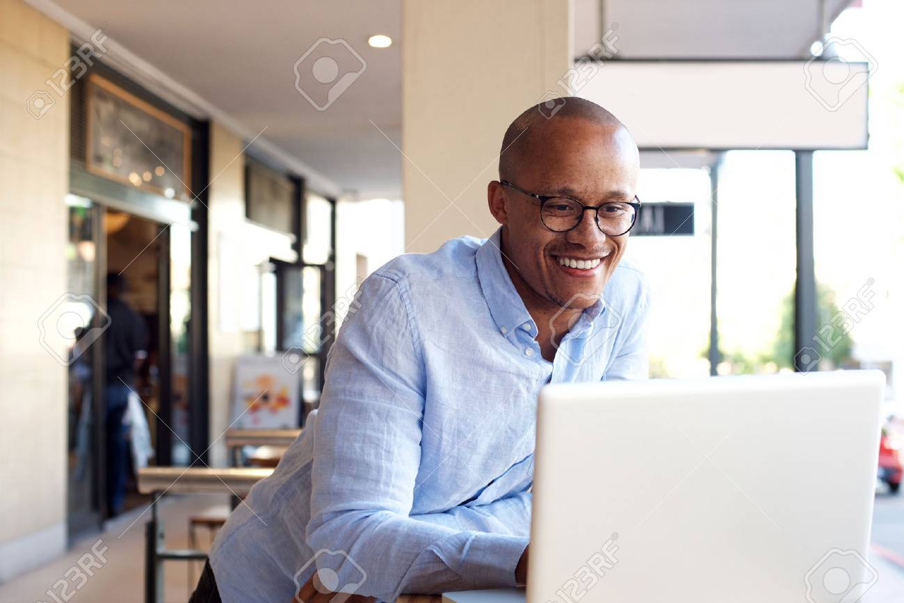 Portrait of handsome african businessman working with laptop - 69300071 Portrait of handsome african businessman working with laptop - 69300071