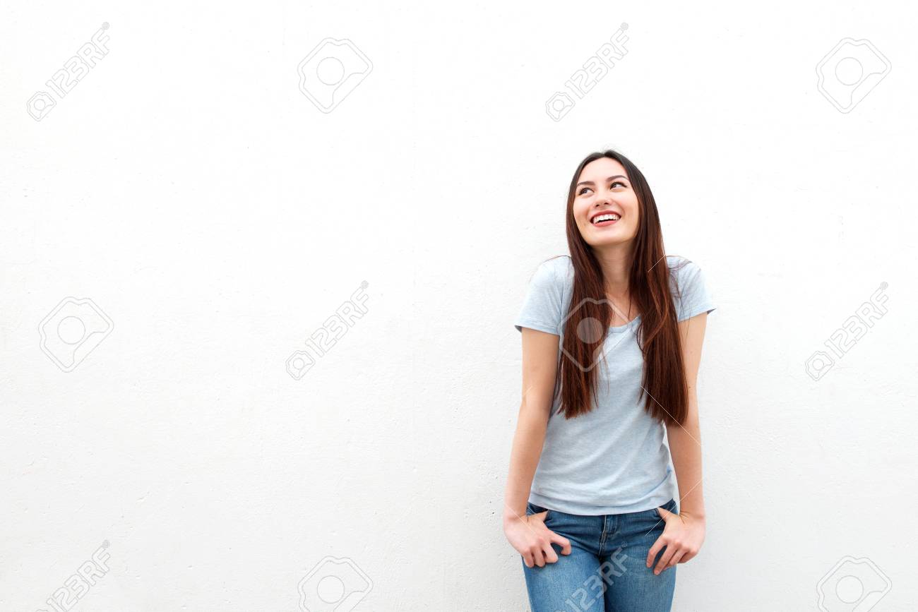 Portrait of cute young woman smiling and looking up on white background - 81809216 Portrait of cute young woman smiling and looking up on white background - 81809216