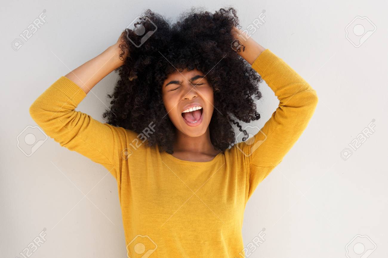 Close Up Portrait Of Young African Girl Screaming And Pulling Her Hair  Against White Background Stock Photo, Picture and Royalty Free Image. Image  96929540., image size:1300x867