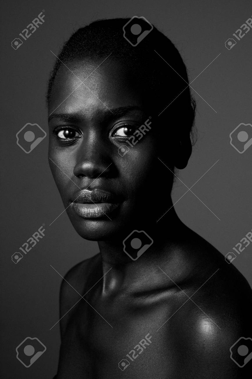 Close up black and white photo of african american woman staring