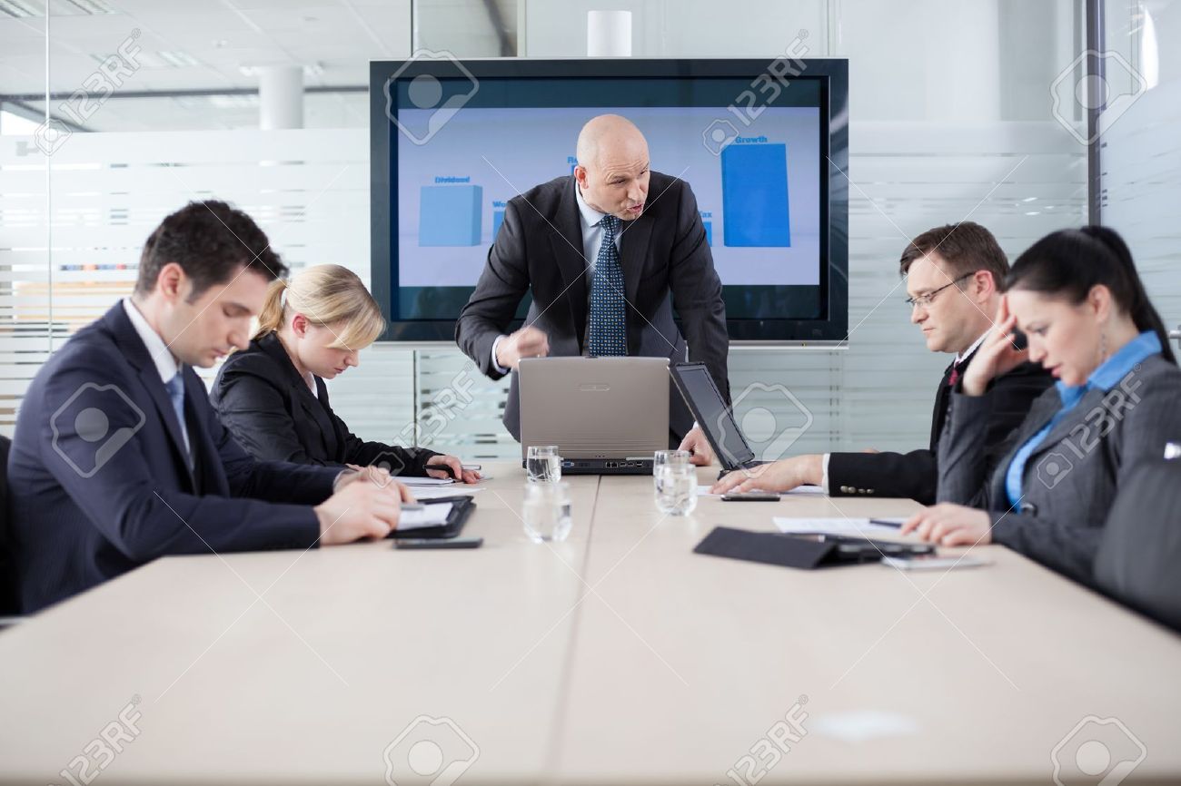 manager yelling at his employees at the meeting company is in company meeting