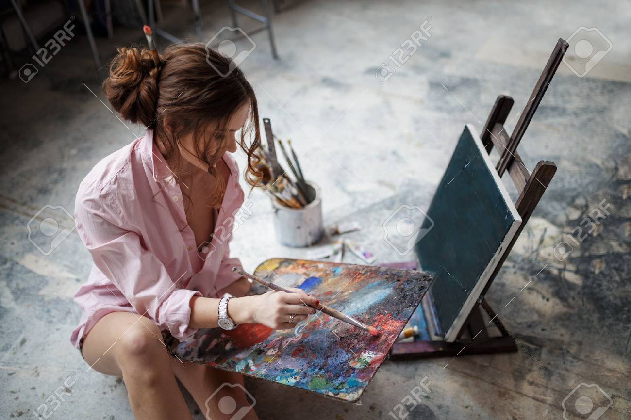 Female Artist Working On Painting In Studio Stock Photo, Picture ...