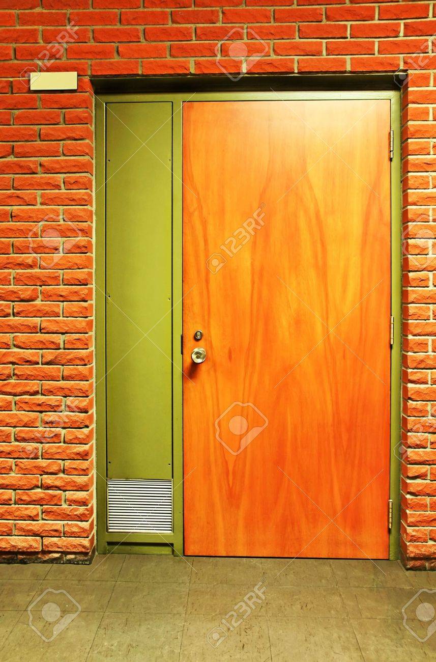 Vertical Of A Closed Wooden Door And Bricks In A School, Room Vertical Of A Closed Wooden Door And Bricks In A School, Room