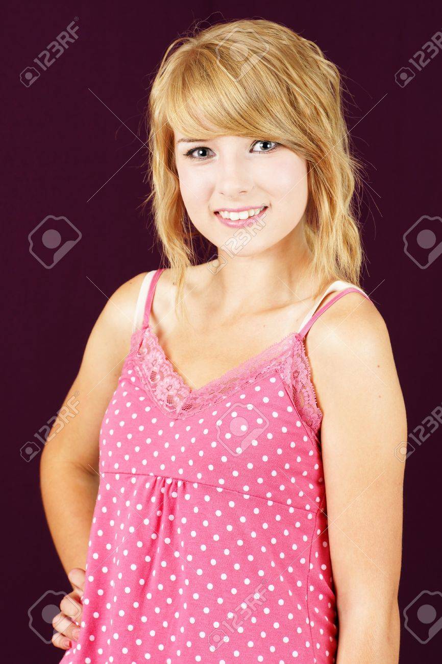 Portrait Of Cute And Innocent Yound Blond Teenager Girl Smiling Studio Shot Over Deep Pink Portrait Of Cute And Innocent Yound Blond Teenager Girl Smiling Studio Shot Over Deep Pink