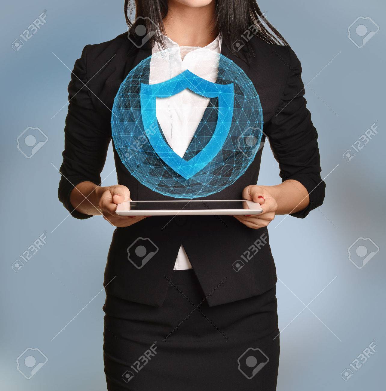 Beautiful girl holding a tablet with digital network globe and shield icon. - 47964254 Beautiful girl holding a tablet with digital network globe and shield icon. - 47964254