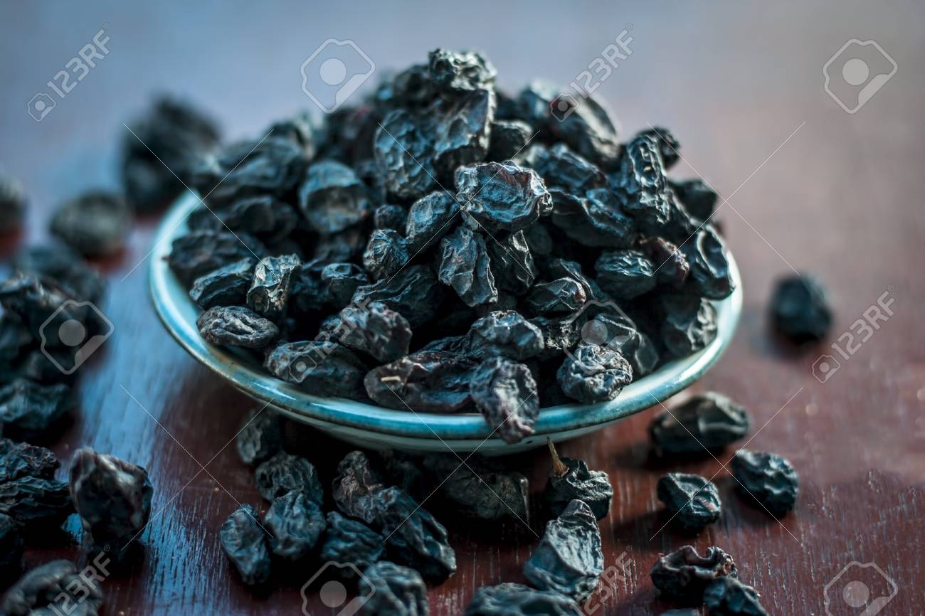 Black Raisin Or Kali Kishmish Or Zante Currant In A White Plate