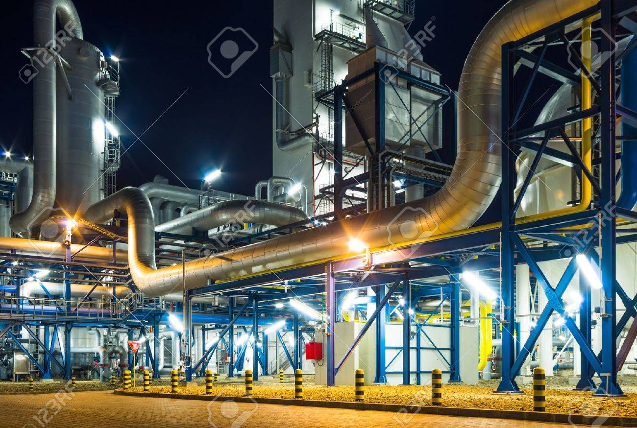 pumps and piping system inside of industrial plant at night - 19942555 pumps and piping system inside of industrial plant at night - 19942555