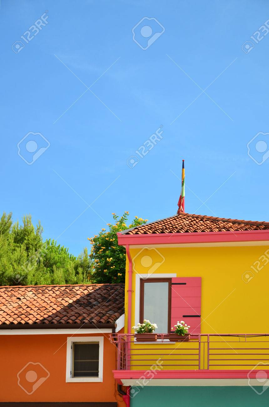 Colorful Yellow And Orange House Facades With Blue Sky In Teh Stock Photo Picture And Royalty Free Image Image