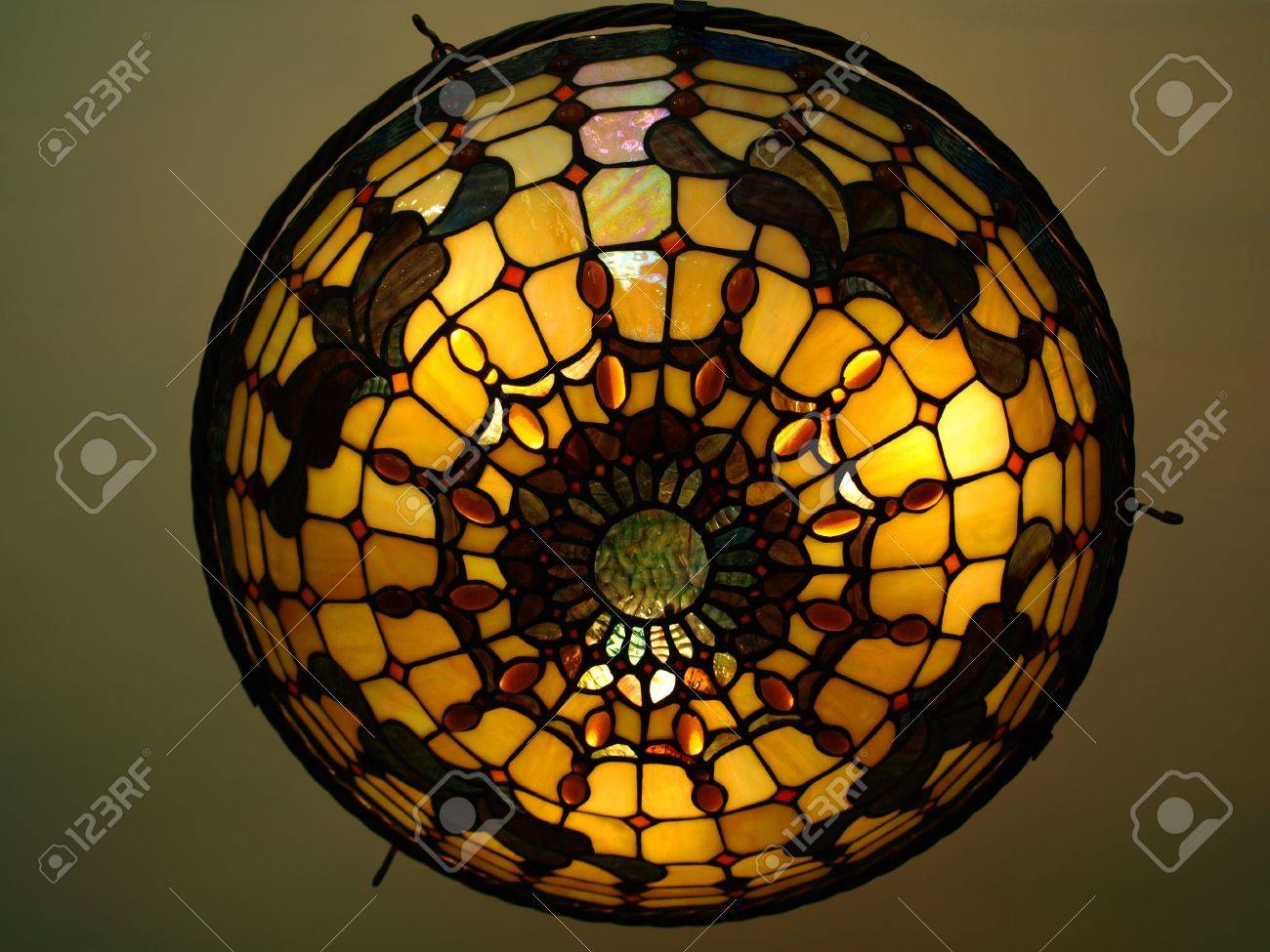 Photo Of A Beautiful Lit Tiffany Style Ceiling Lamp In Warm And