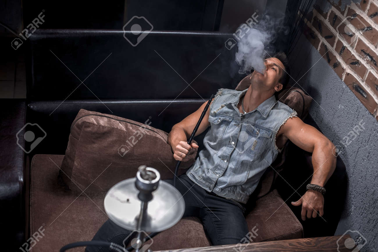 Brutal Guy Smoking Hookah In The Shisha Hose. Stock Photo, Picture and  Royalty Free Image. Image 158942962., image size:1300x865
