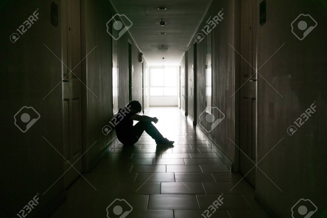 silhouette of business man sitting alone sad and serious male