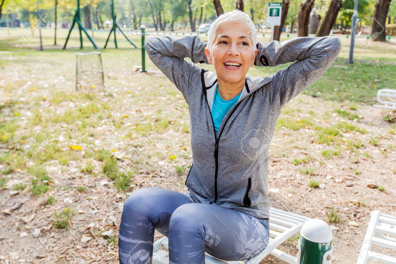 Fitness Senior Woman Exercise At Outdoor Gym Sports Clothes