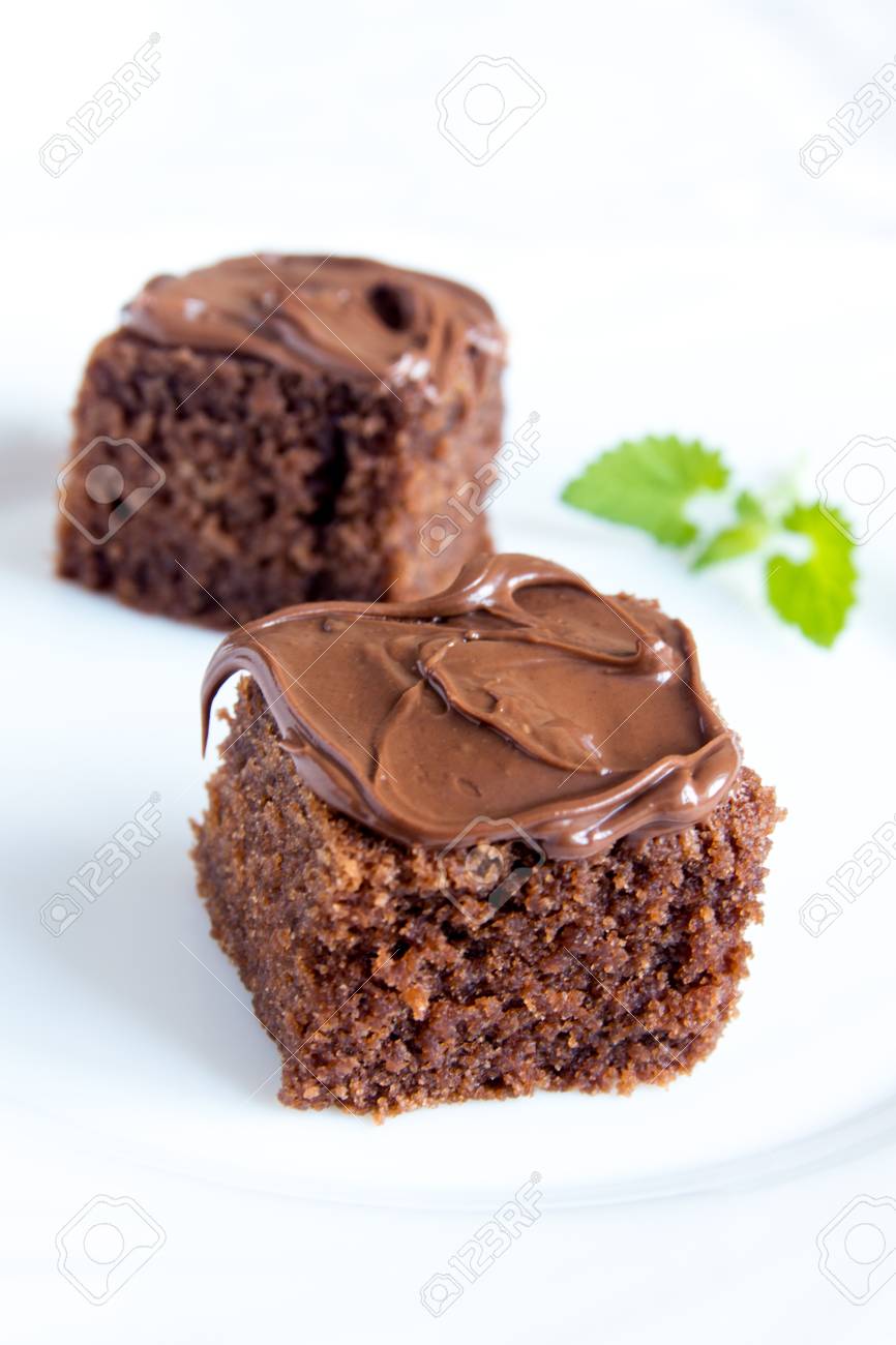 Chocolate Mini Cakes With Chocolate Icing And Mint On White Plate Stock Photo Picture And Royalty Free Image Image 50968799