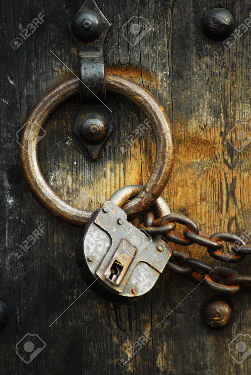 Heavy Wooden Doors With Chains And Padlocks Are All About Security ... Heavy Wooden Doors With Chains And Padlocks Are All About Security ...