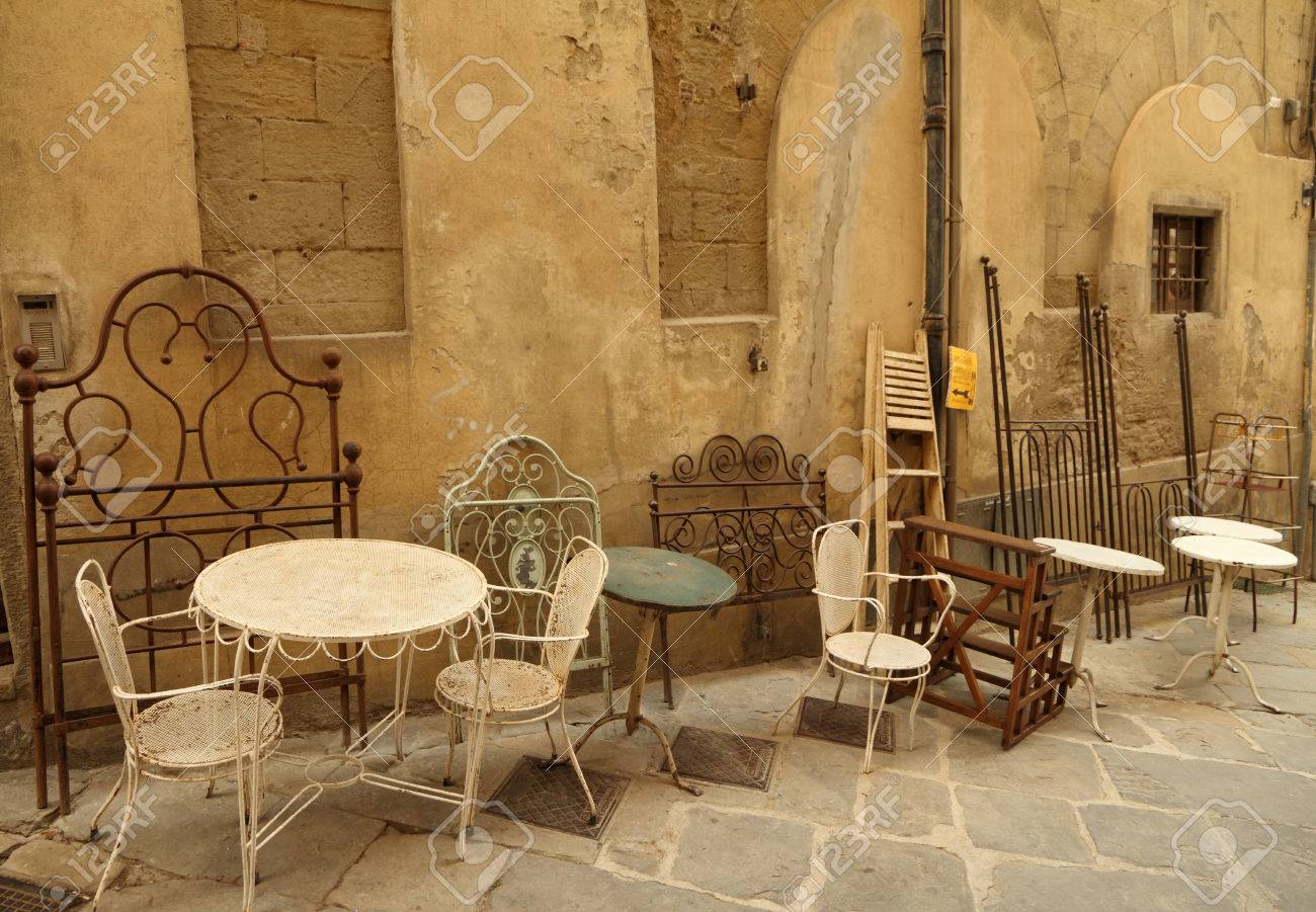 Assortment Of Old Fashion Furniture Objects Displayed On Street assortment of old fashion furniture objects displayed on street during famous Antiquity Market in tuscan town - Assortment Of Old Fashion Furniture Objects Displayed On Street