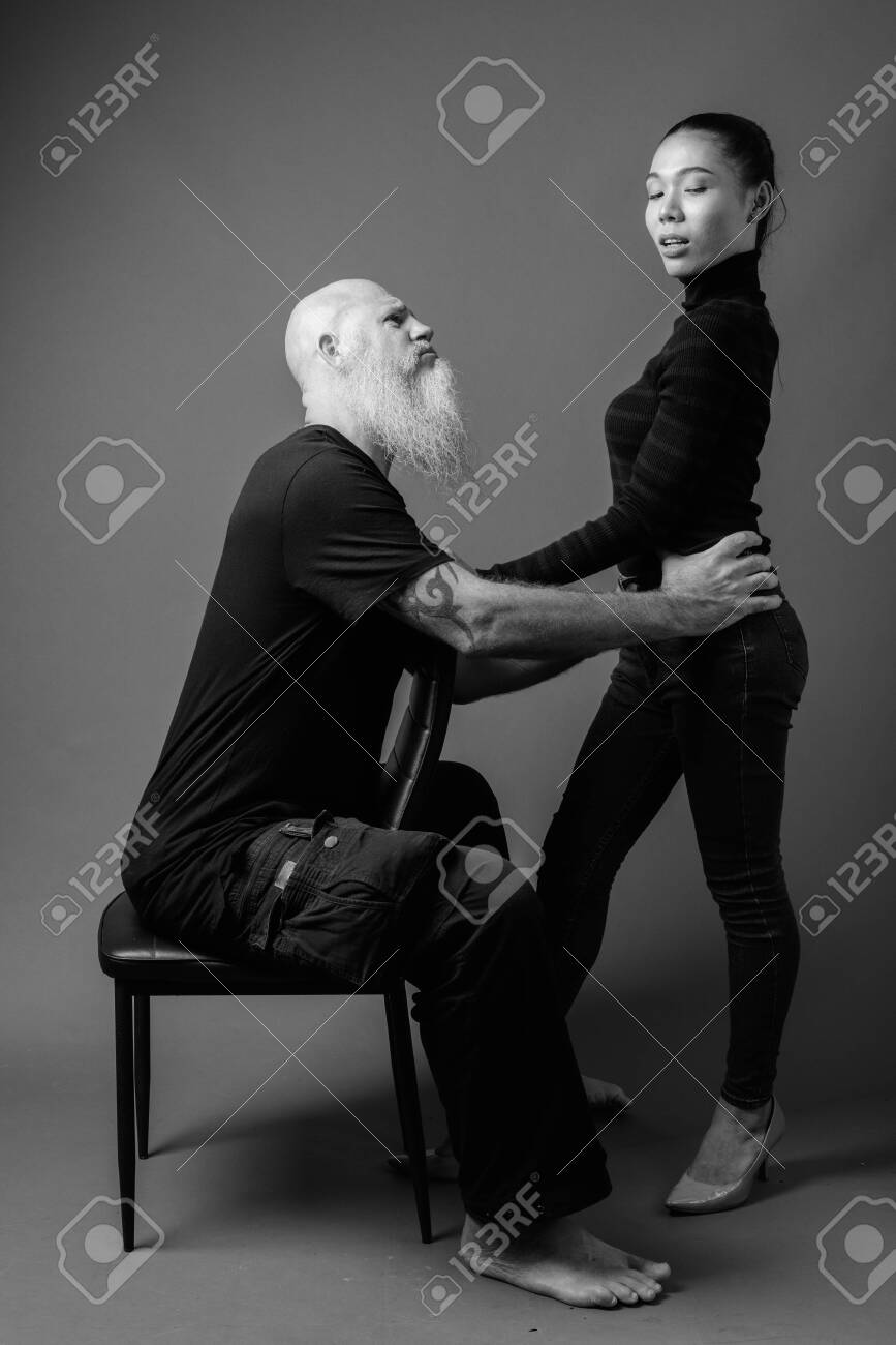 Mature Bearded Bald Man With Young
