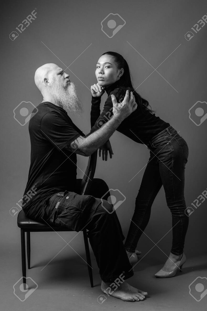 Mature Bearded Bald Man With Young