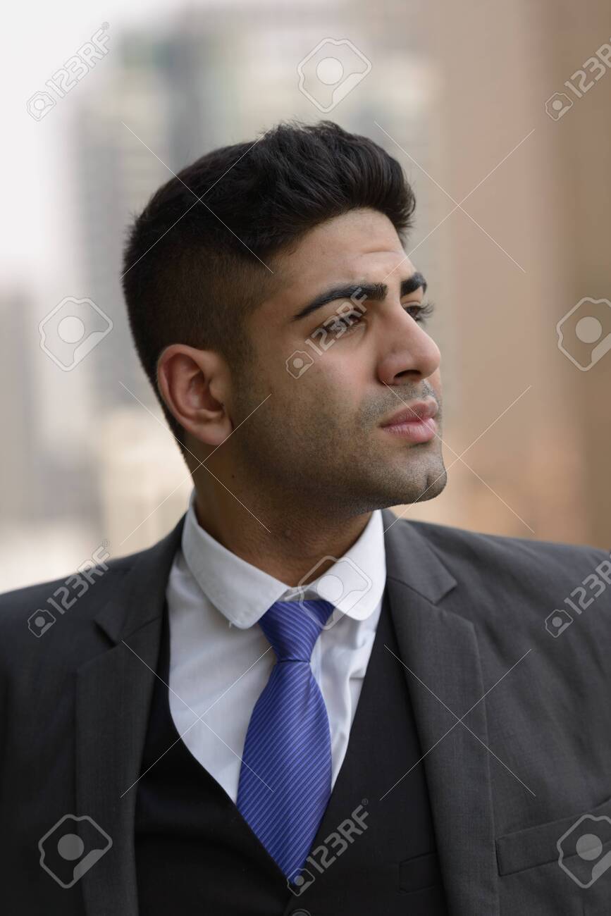 Face of young handsome Indian businessman thinking in the city - 150528350 Face of young handsome Indian businessman thinking in the city - 150528350