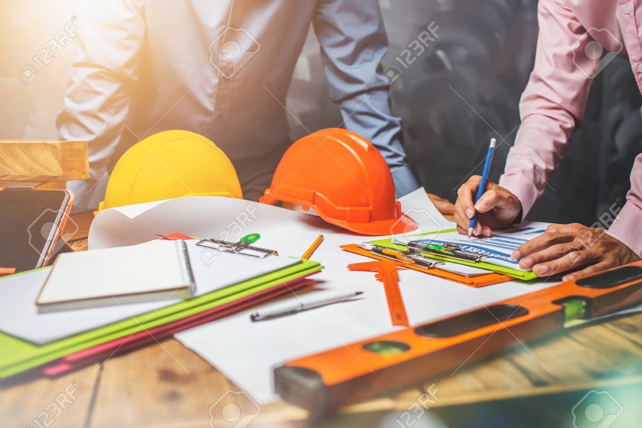 Structural engineer teamwork discussing hardworking in the office on building structure concept of worldwide building project. - 84157015 Structural engineer teamwork discussing hardworking in the office on building structure concept of worldwide building project. - 84157015