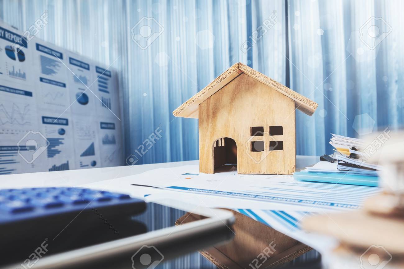 House and property for sale concept, wood house toy on office desk. - 90880852 House and property for sale concept, wood house toy on office desk. - 90880852