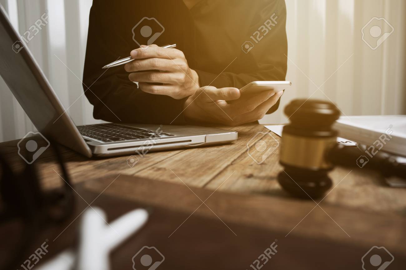 Young lawyer working hard alone in his office. - 93010058 Young lawyer working hard alone in his office. - 93010058