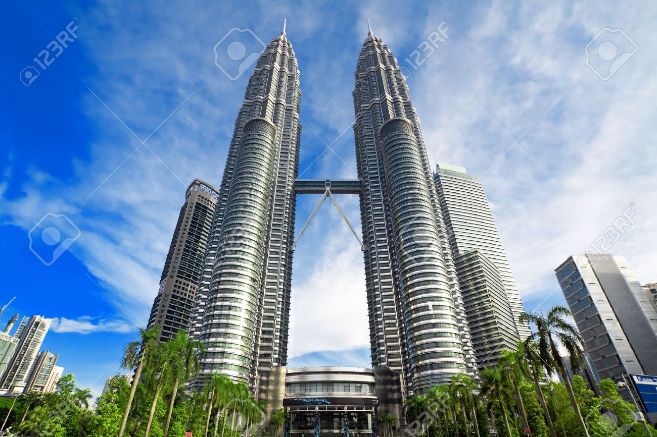 KUALA LUMPUR, MALAYSIA - JANUARY 8: Petronas Twin Towers at day on January 8, 2014 in Kuala Lumpur. Petronas Twin Towers were the tallest buildings (452 m) in the world from 1998 to 2004 - 28893739 KUALA LUMPUR, MALAYSIA - JANUARY 8: Petronas Twin Towers at day on January 8, 2014 in Kuala Lumpur. Petronas Twin Towers were the tallest buildings (452 m) in the world from 1998 to 2004 - 28893739