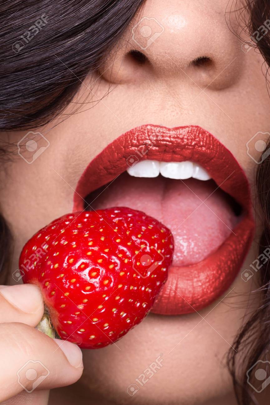 One Young Woman Skin Lip Tongue Licking Starberry Red Lipstick Stock Photo Picture And Royalty Free Image Image