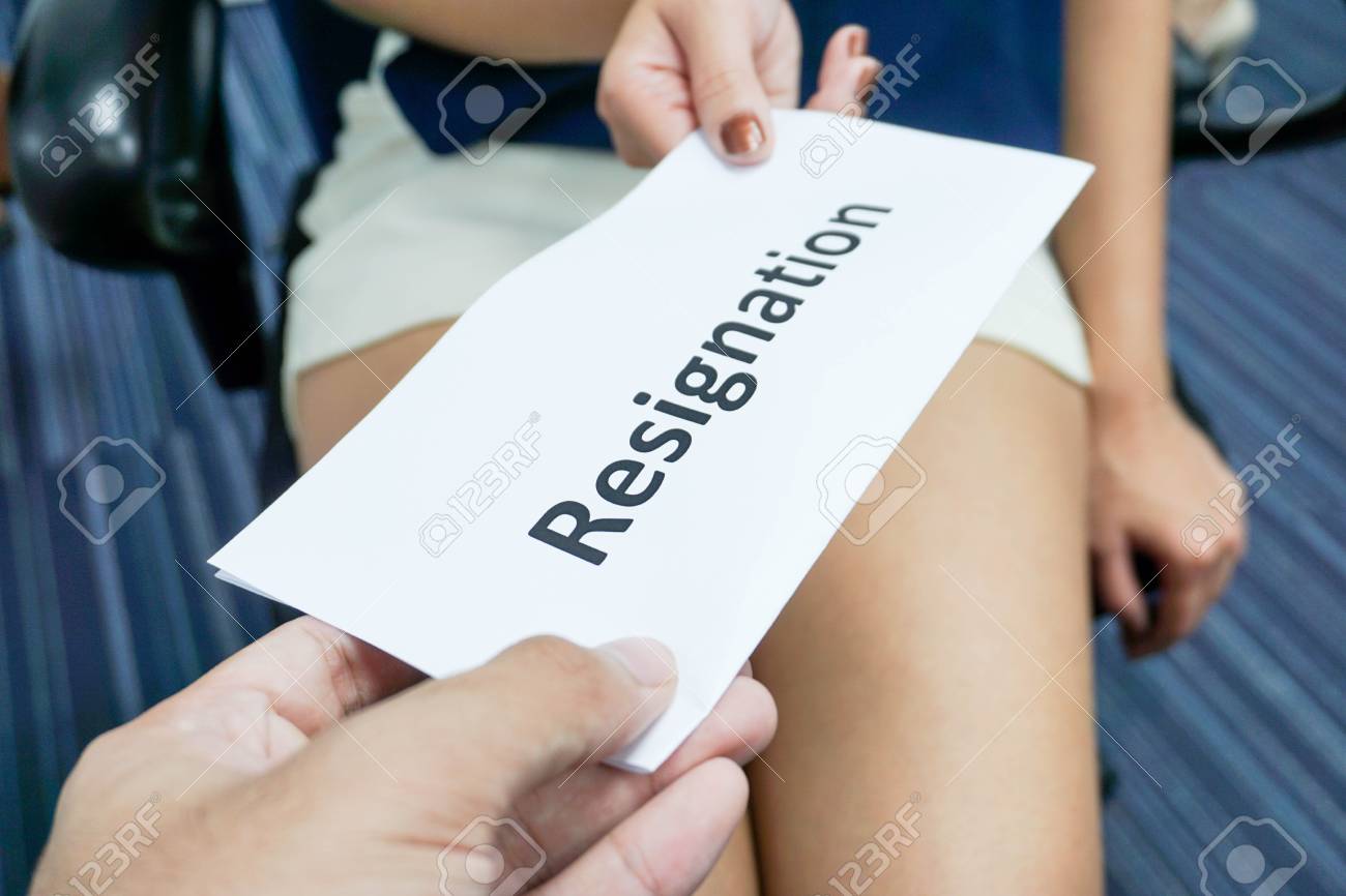 woman submit a resignation letter to the boss stock photo picture