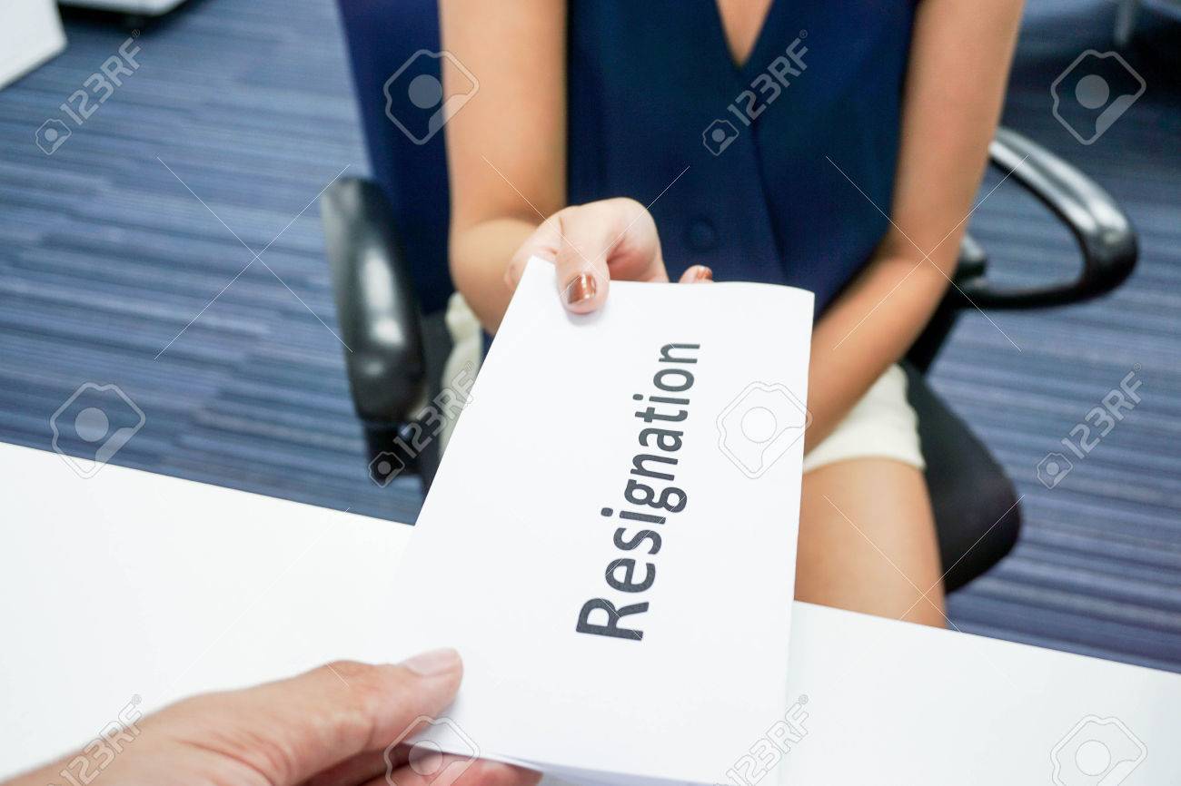 a woman submit a resignation letter to her boss stock photo picture how to submit resignation