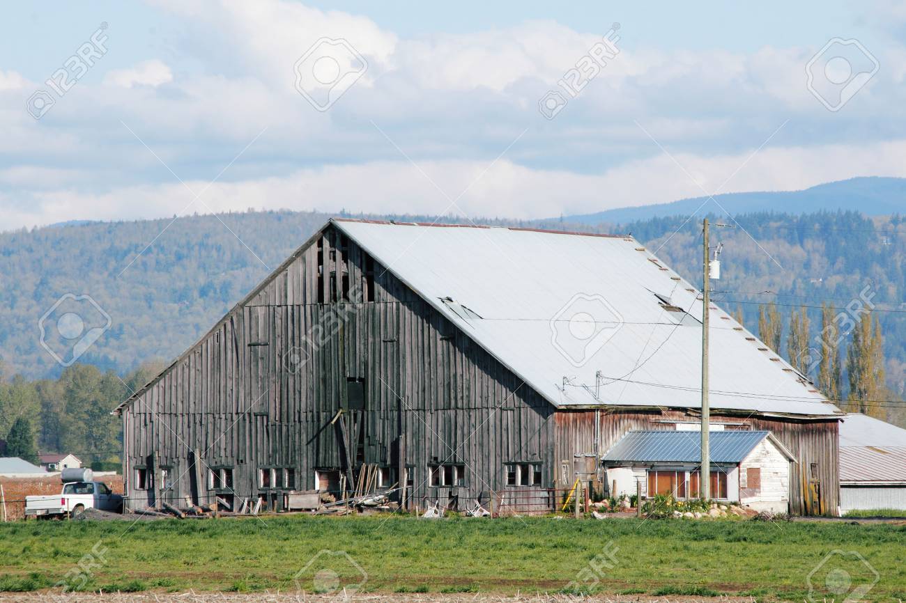 A Weathered Barn That Is Used For Storing Hay Stock Photo